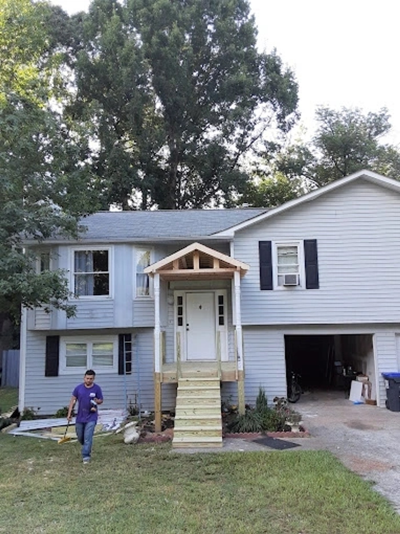 Home with new concrete driveway and steps