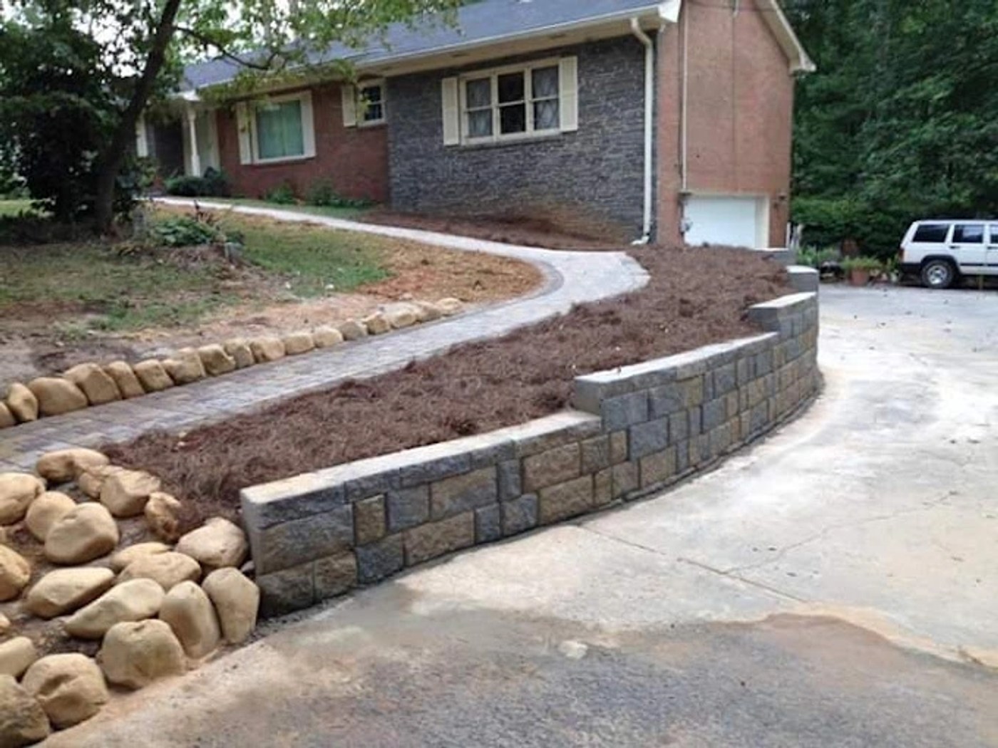 New retaining wall and concrete driveway